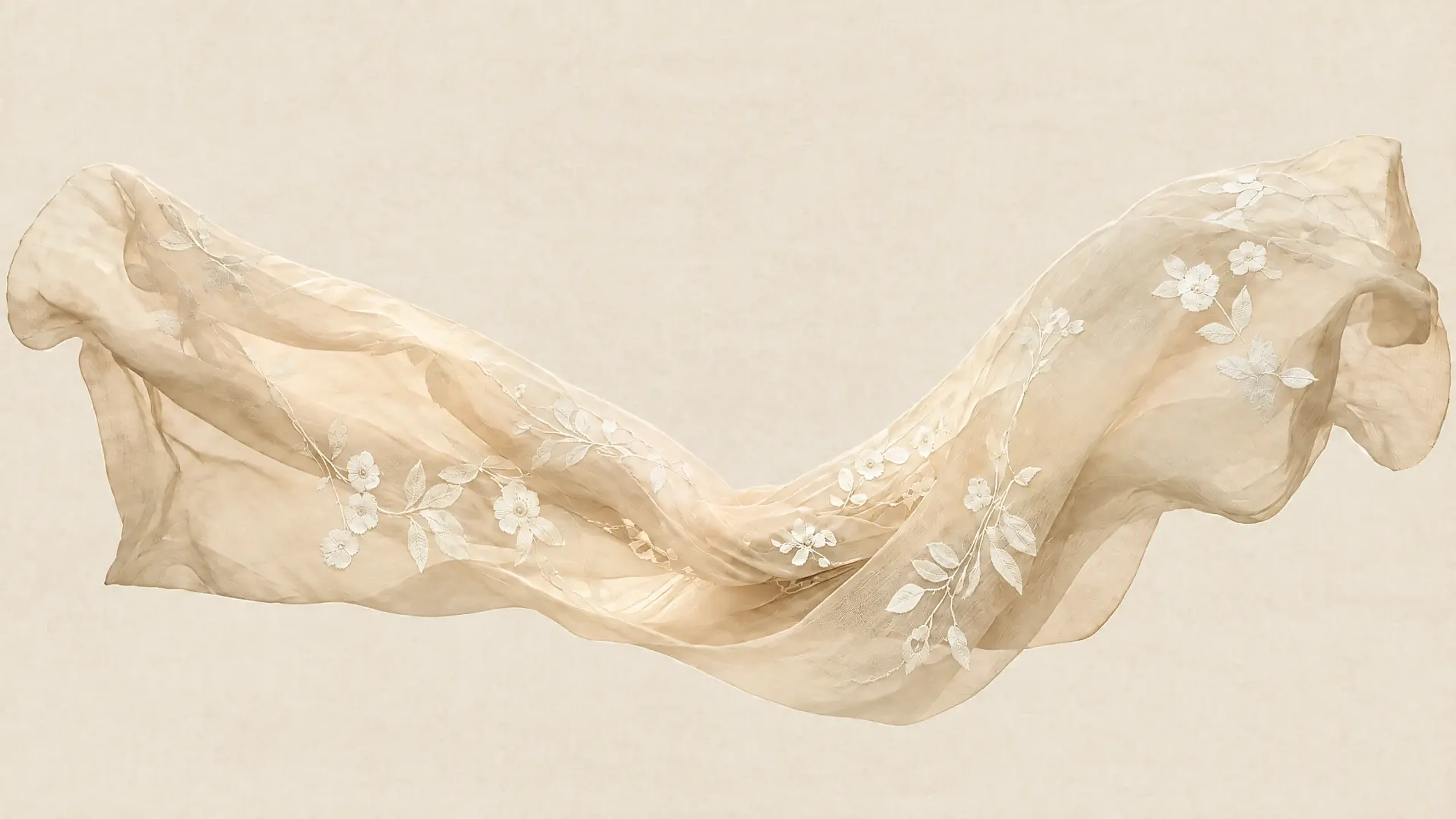 Hand-embroidered NISLIN linen falling in warm daylight